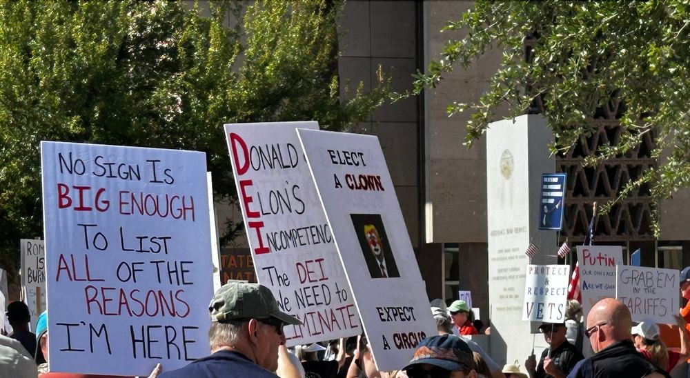 Several signs at protest:
No sign is big enough to list all of the reasons I'm here.
Donald & Elon's Incompetence: The DEI we need to eliminate.
Elect a clown, expect a circus.