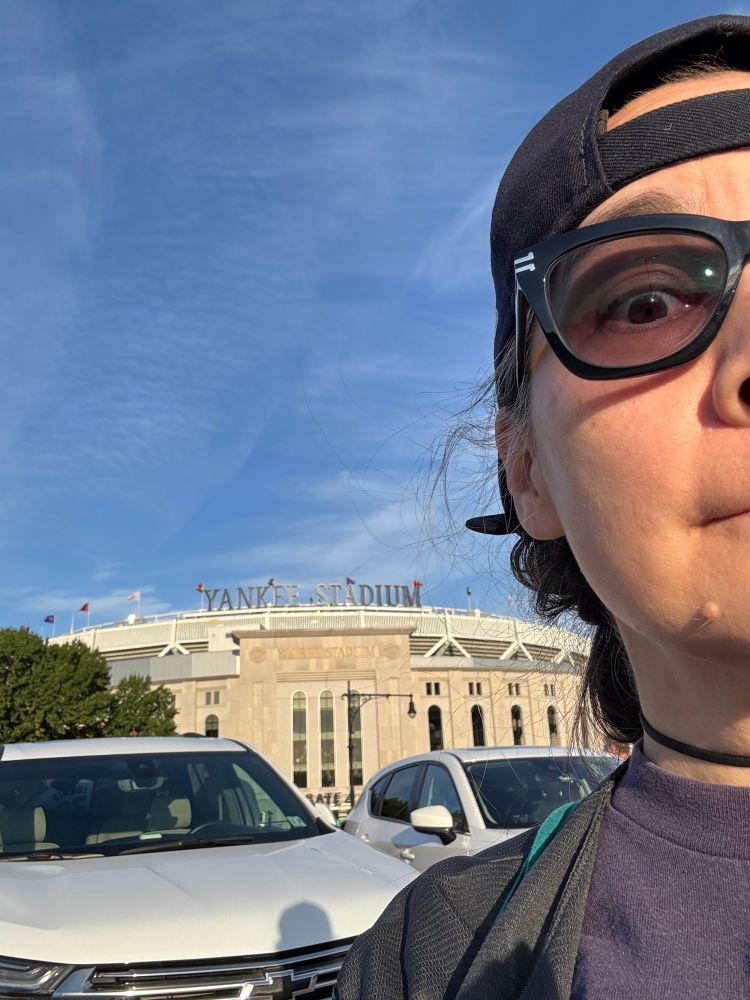 Half of my face with Yankee stadium in the background 
