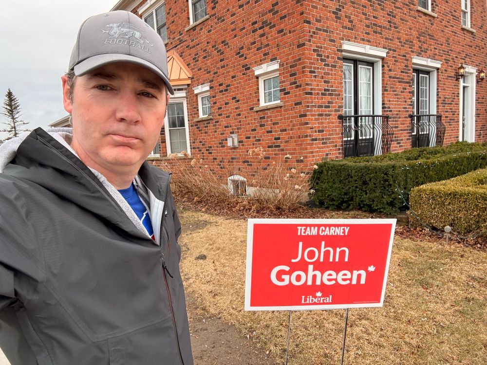Me standing in front of a John Goheen Liberal Candidate sign. 
