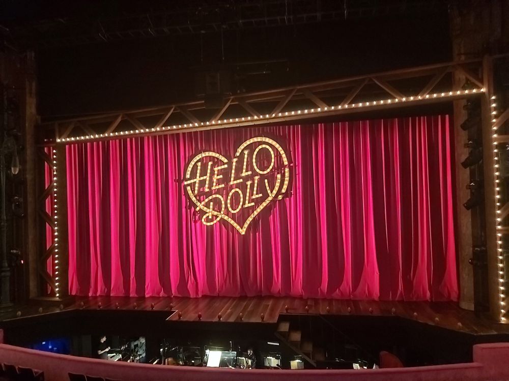 London Palladium Production of Hello Dolly.  Red curtain with Hello Dolly written in a heart.