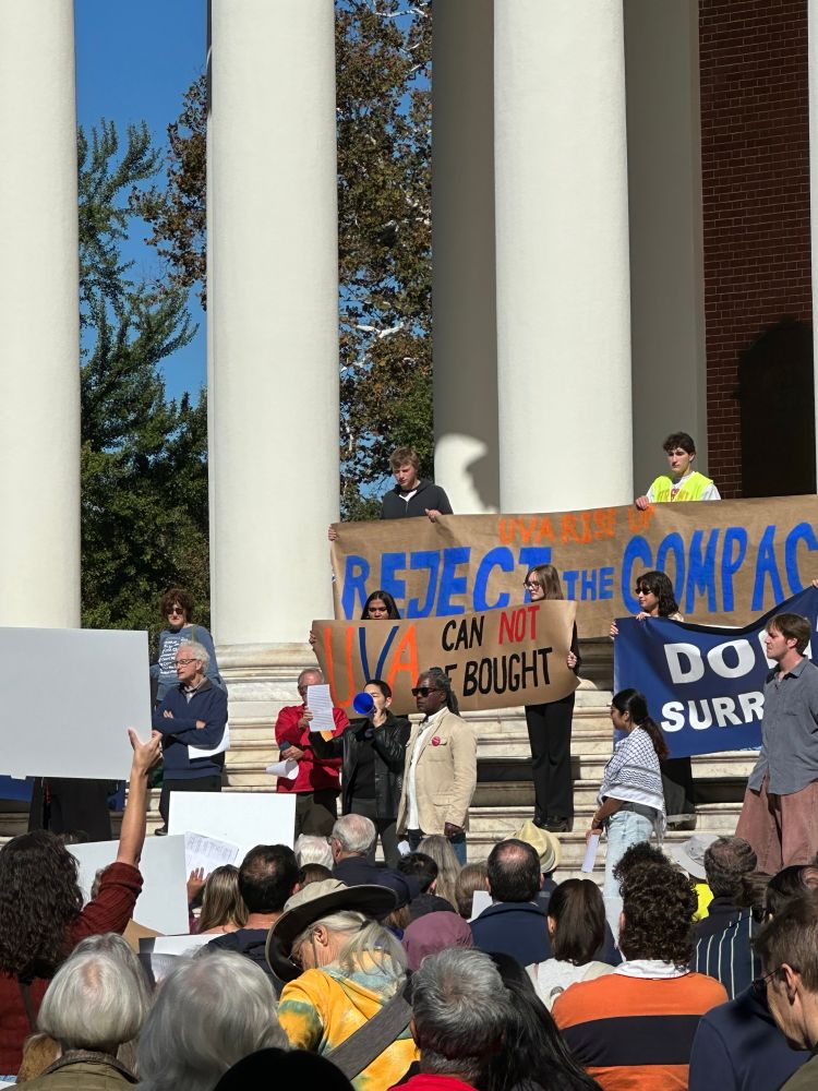 Speaker with megaphone at the Reject the Compact in front of the Rotunda.
