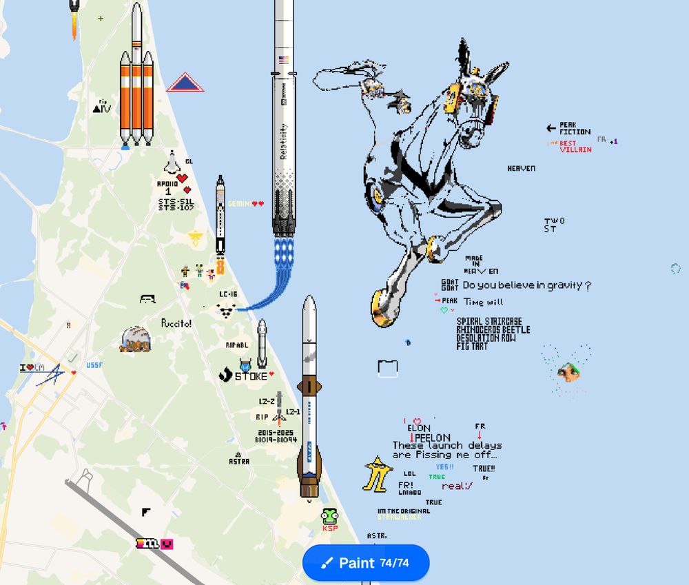 an incomplete but very large pixel art rendition of Made in Heaven from Stone Ocean near several NASA rockets on wplace. to its south there's also a Starwalker saying "These launch delays are pissing me off..."