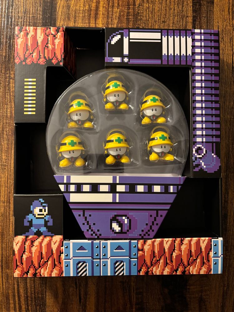 the Jada Toys Neo Metall set with six Met figures in a package based on the Metall Potton miniboss from Mega Man 6