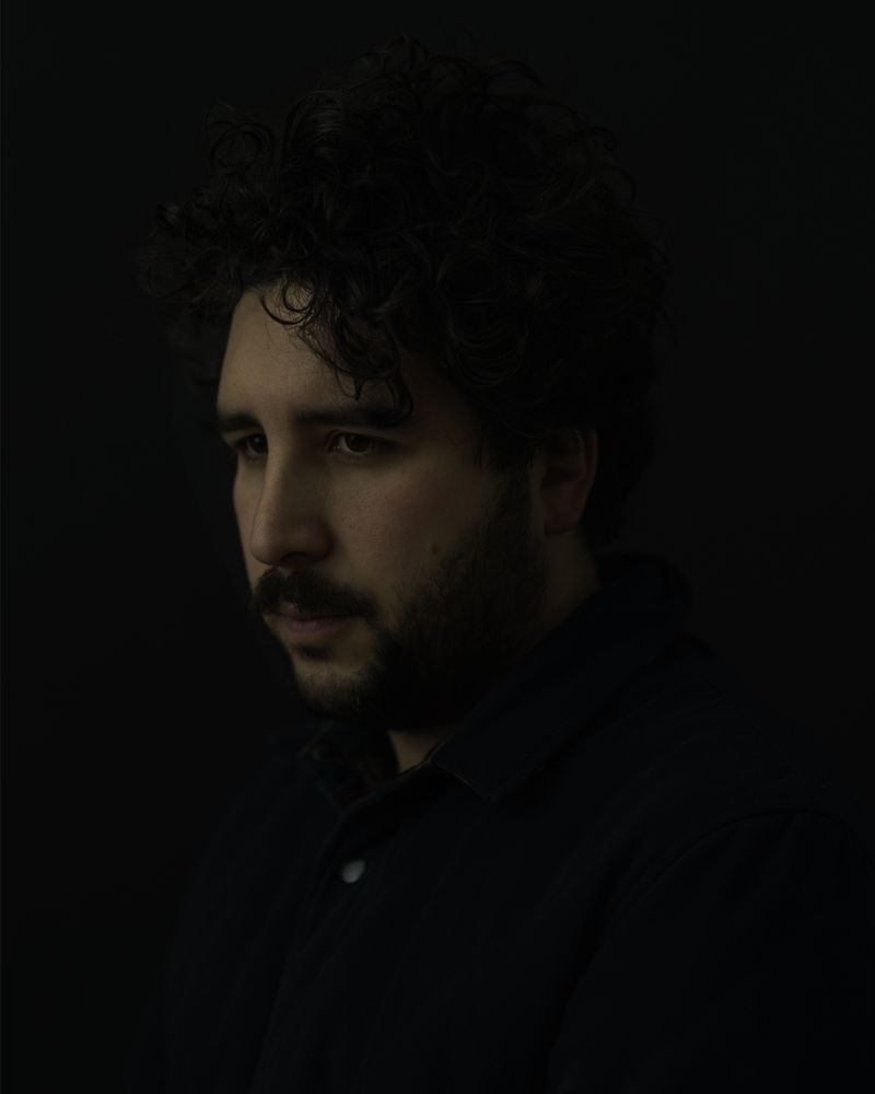 Portrait of Jaime, a sombre looking man, in light akin to what you can see on Rembrandt paintings