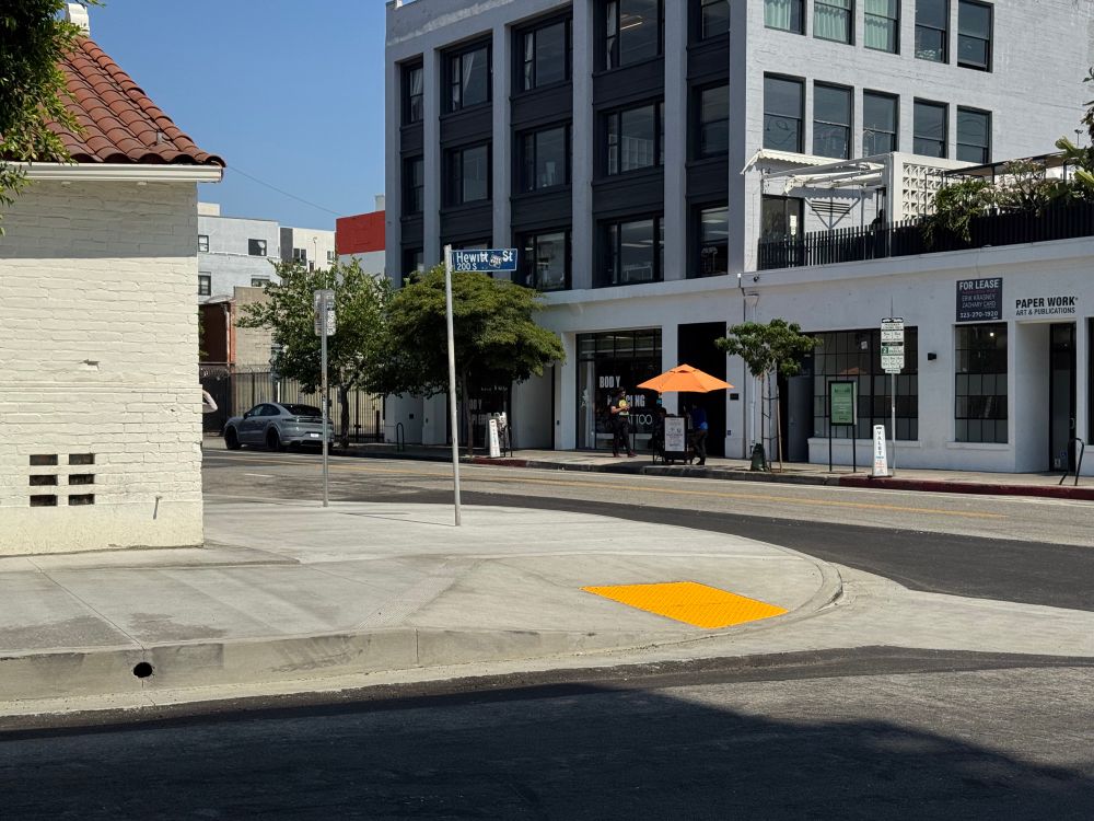An extended curb with ADA ramps on Hewitt and 3rd.