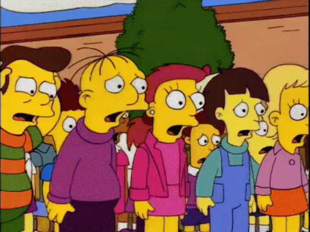 a group of cartoon characters are standing in front of a christmas tree and looking surprised .