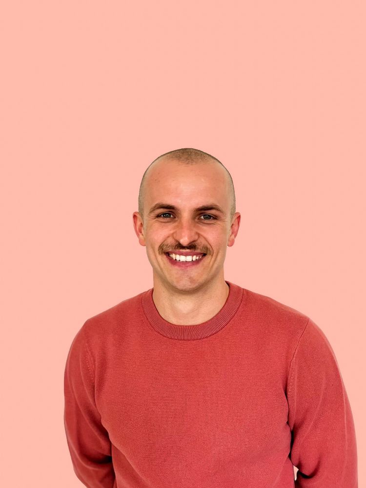 Profile photo of me in my favorite coral jumper.