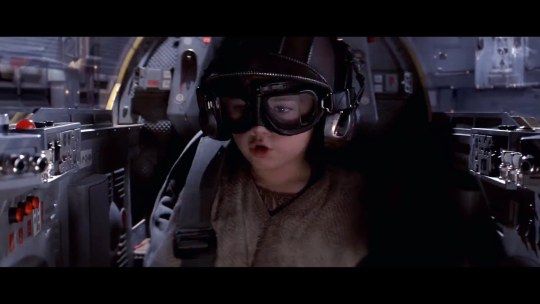 A screenshot from Star Wars Episode 1 where kid Anakin is piloting a spaceship.