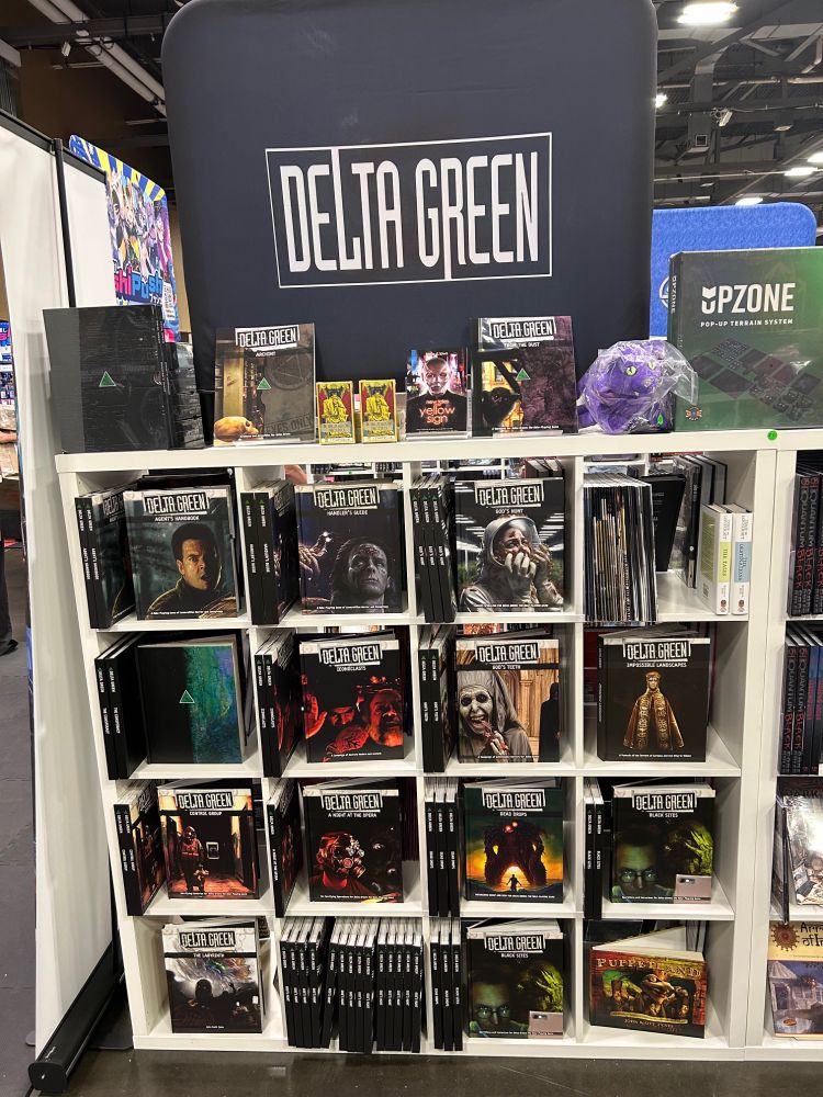 Shelves full of Delta Green books at Origins Game Fair