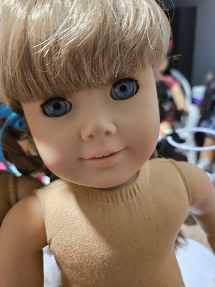 The Kirsten on the right, but showing a dark spot on her nose