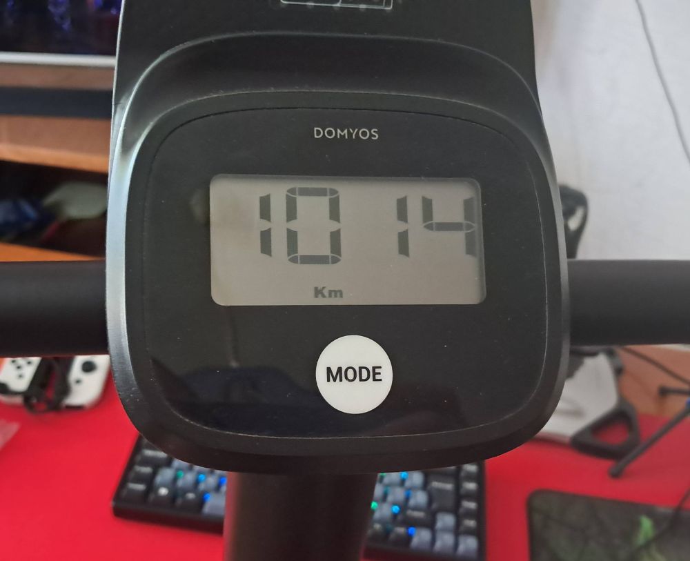 Exercise bike odometer showing 1014 km