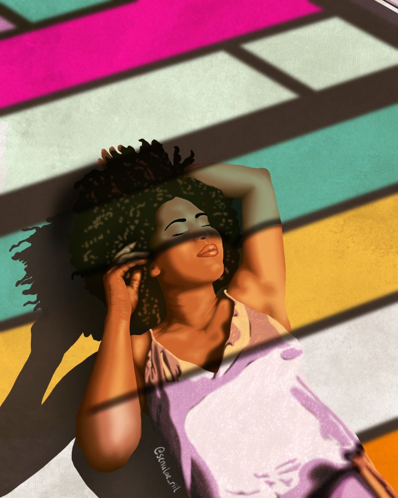 An African American woman is lying on a floor in a lavender silk shirt. She has her hands near her afro and is covered in stained glad lighting from windows around her. 