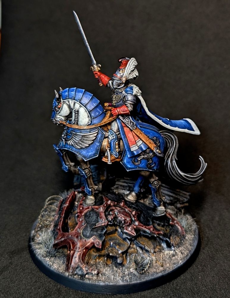 Converted Lord Solar. Custom theme based on 17th / 18th century french army units. Replaced head with a dragoon helmet, replaced sword and cloak. Added feathers to helm from a necromunder kit.