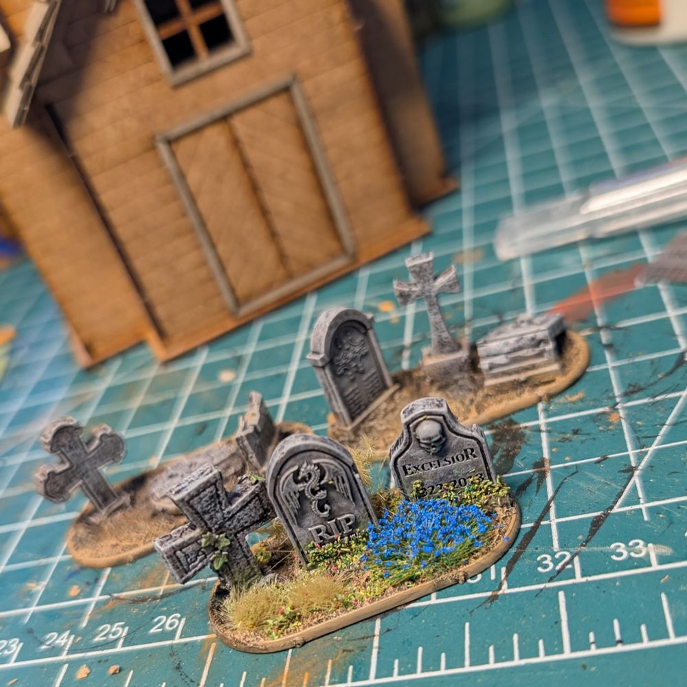 Scenery and scatter terrain for silver bayonet. Gravestones and an MDF church kit.