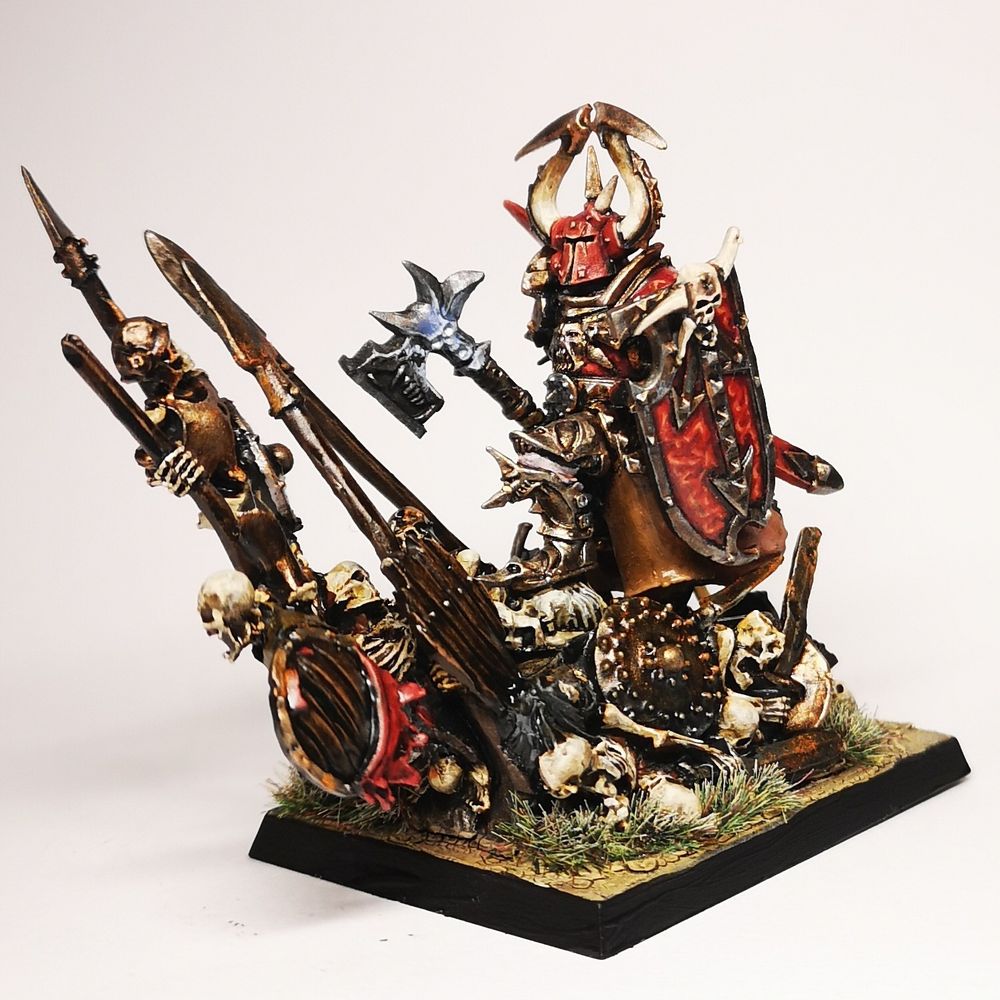 25th anniversary harry the hammer. Painted red and brass, very very khorne.... Blood for the blood god! Based on a pile of skeletons.