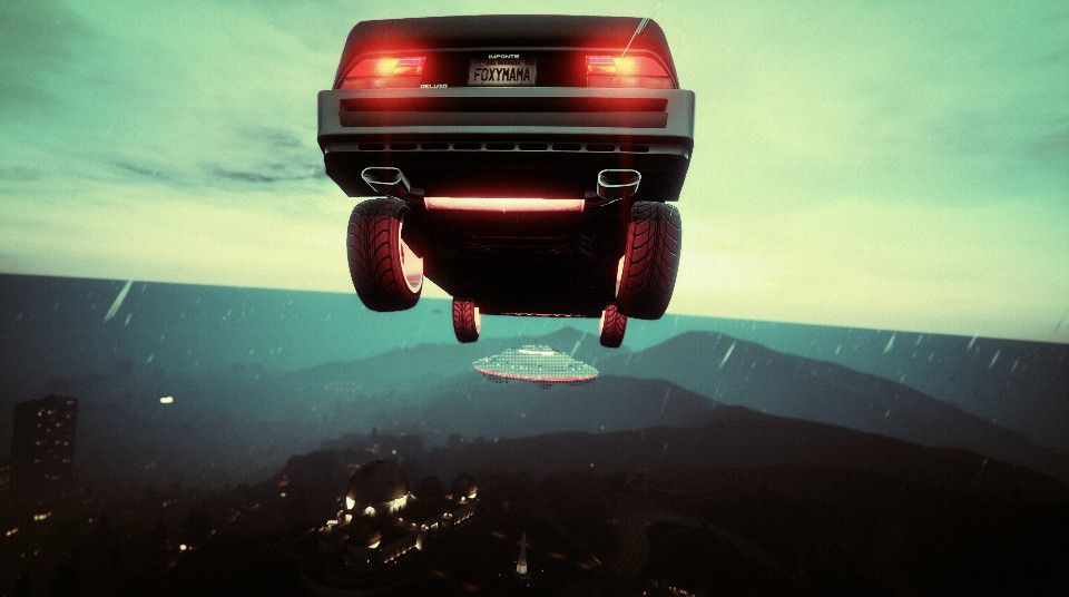 Screenshot of GTA Online. FemDiff is about to land her deluxo onto a UFO (3 of 5) that is hovering over the Galileo Observatory.