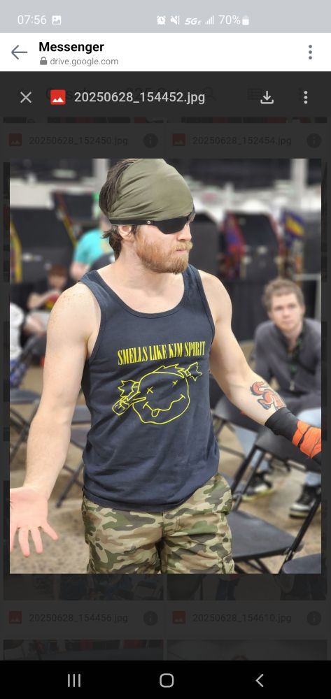 Weber Hatfield as Snake before Cosplay Pro-Wrestling, wearing a Smells Like Kim Spirit tank top