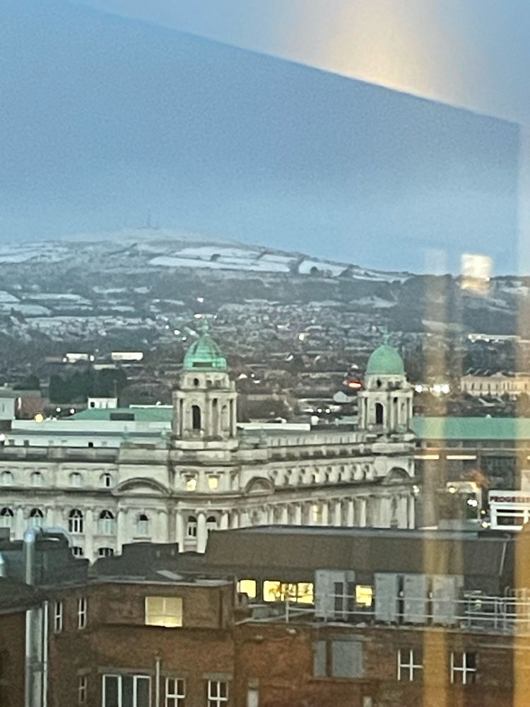 Snow hills behind Belfast city centre 