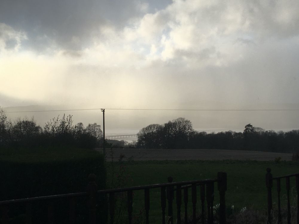 A view across Cromarty Firth. Rain, mist, and a lot of moody clouds.