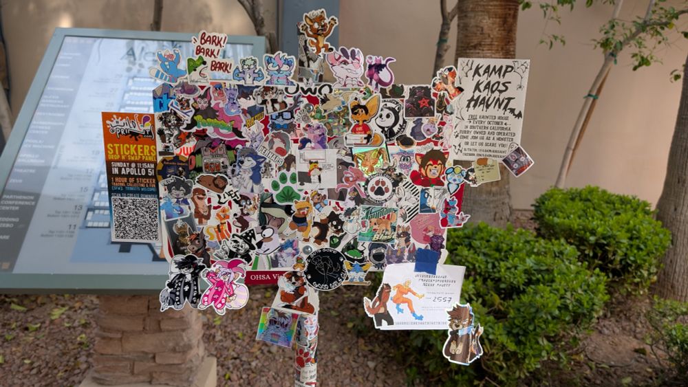 Sign post at Las Vegas Fur Con covered in stickers