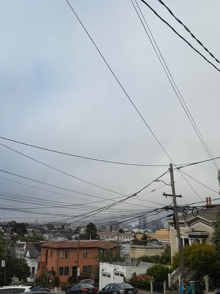 Picture of fog over San Francisco that's heading downtown to hide the AI overlords 