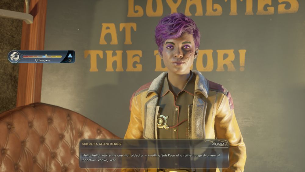 A character from Outer Worlds 2. She's a Black femme with vibrant purple hair styled in a short cut, purple eyes, purples eyeshadow, and purple lip gloss. She has a scar under her left eye and is wearing Sub Rosa garbs.
The box below her states:
Sub Rosa Agent Kobor
"Hello, hello! You're the one that aided us in availing Sub Rosa of arather large shipment of Spectrum Vodka, yes?"