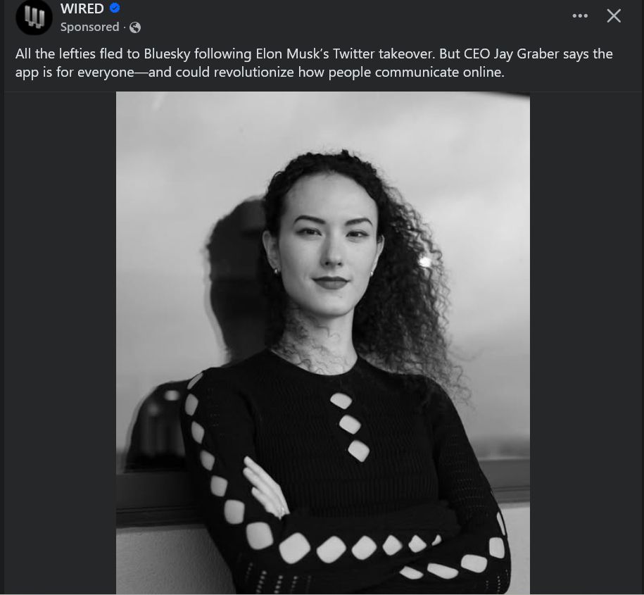 Photo of JG leaning against a window. Her arms are crossed in true So Girl: Much Boss fashion, and she has the obnoxious smirk of someone who replies to people who ask her to please make it a little harder for hateful people to be complete assholes on her site -- which she owns and is responsible for -- with "waffles"