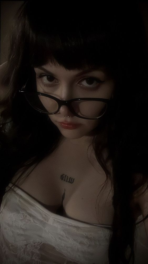 Me. White woman, with tattoo and glasses