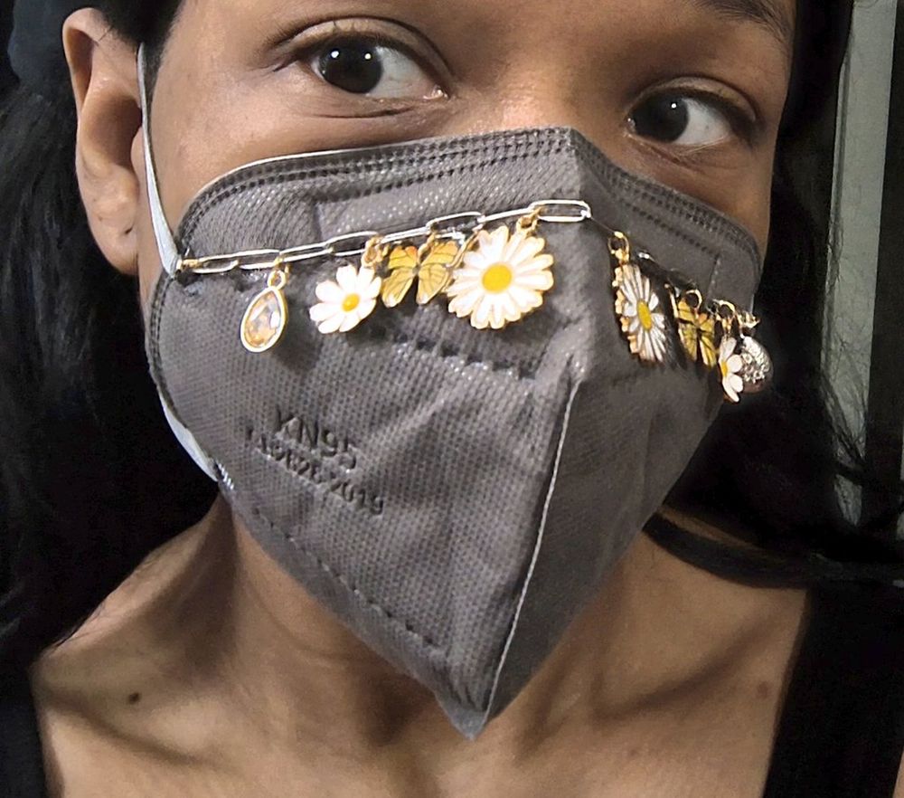 Cupcake in a mask wearing one of the chains