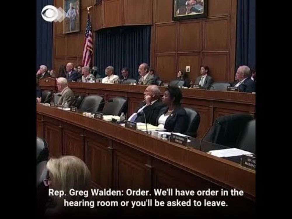WEB EXTRA: Congressman Drowns Out Protester With Auction Call