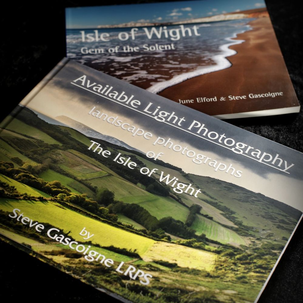 Steve Gascoigne of Available Light Photography's new book "Landscape photographs of the Isle of Wight" laid on top of his earlier book "Gems of the Solent" (a 2004 collaboration with June Elford.)