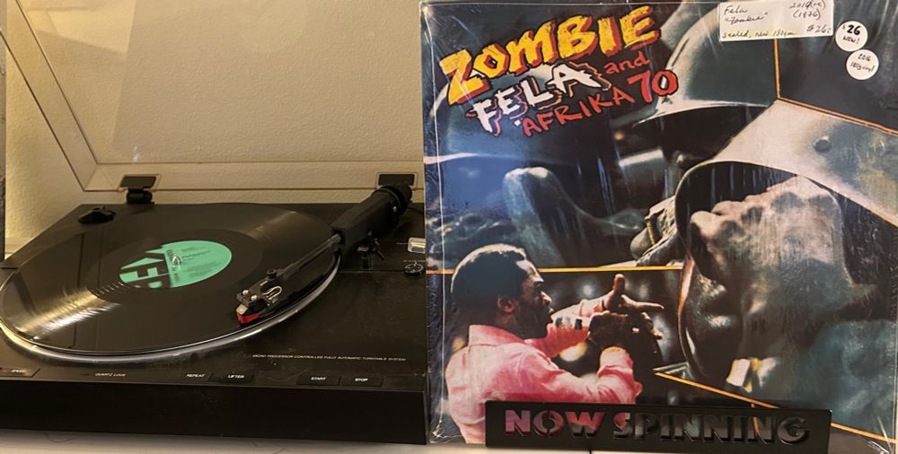 Outer sleeve and spinning vinyl record. Fela Kuti and Afrika 70 “Zombie”