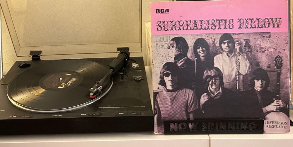 Outer sleeve and spinning vinyl record.  Jefferson Airplane “Surrealistic Pillow”