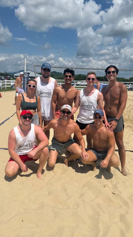 group of people on a volleyball court