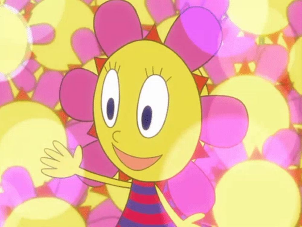 a cartoon character with a yellow face and pink flowers