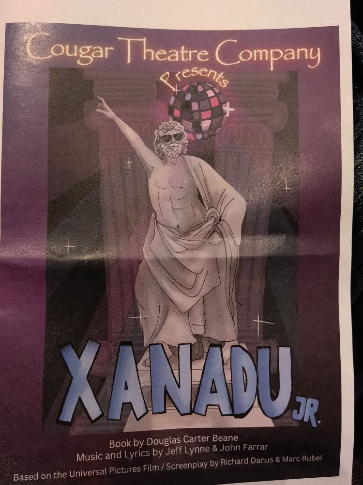 Program book for Xanadu Jr, featuring a Greek god doing the disco point thing.