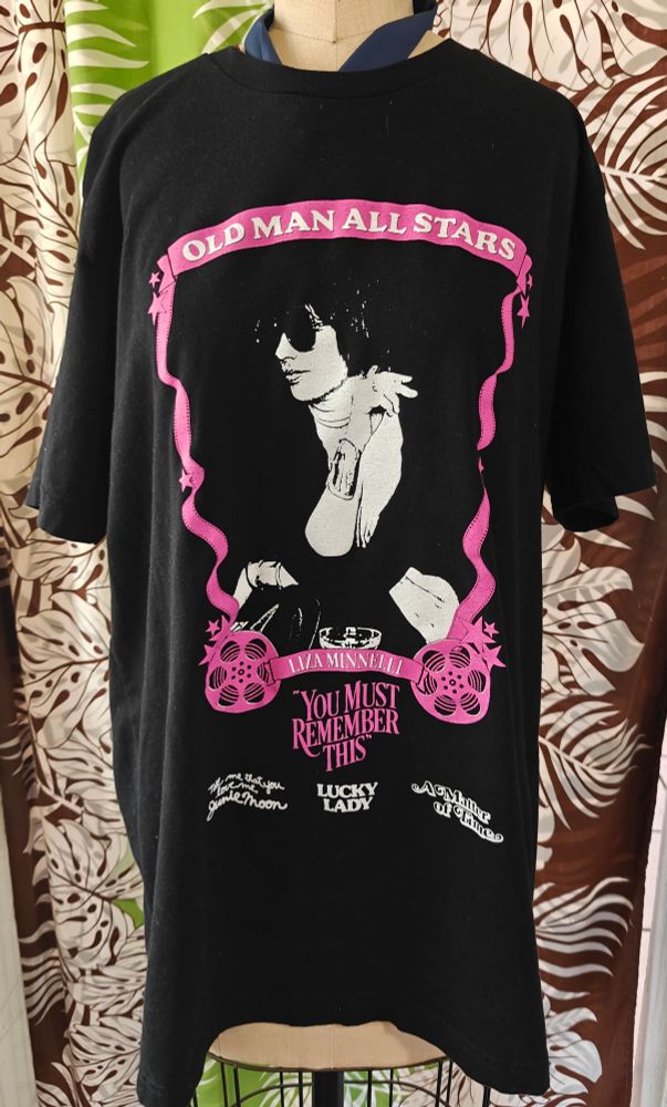 A black t shirt on a dress form. 