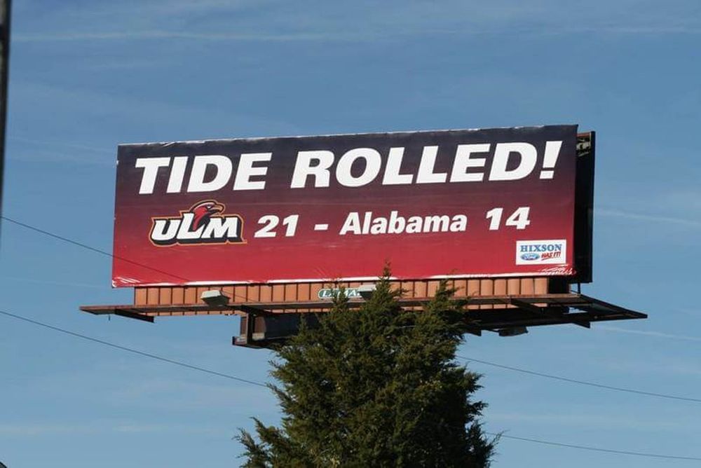 A billboard that says: TIDE ROLLED! ULM 21 - Alabama 14