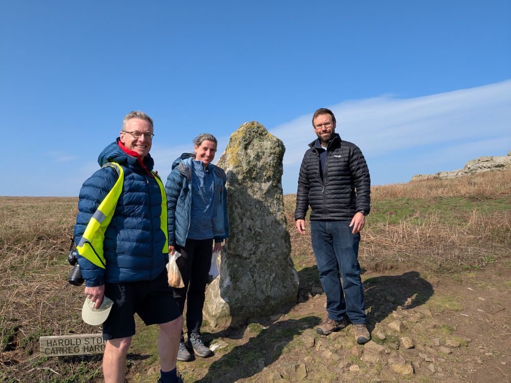 Toby, Lou & Julian from the Royal Commission standing next to the Harold Stone, Skomer