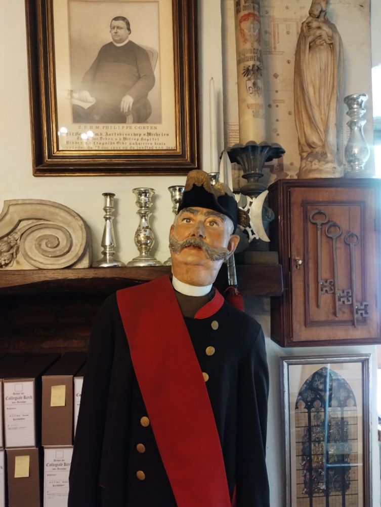 Life-sized puppet sporting a mustache and dressed in ceremonial clothes