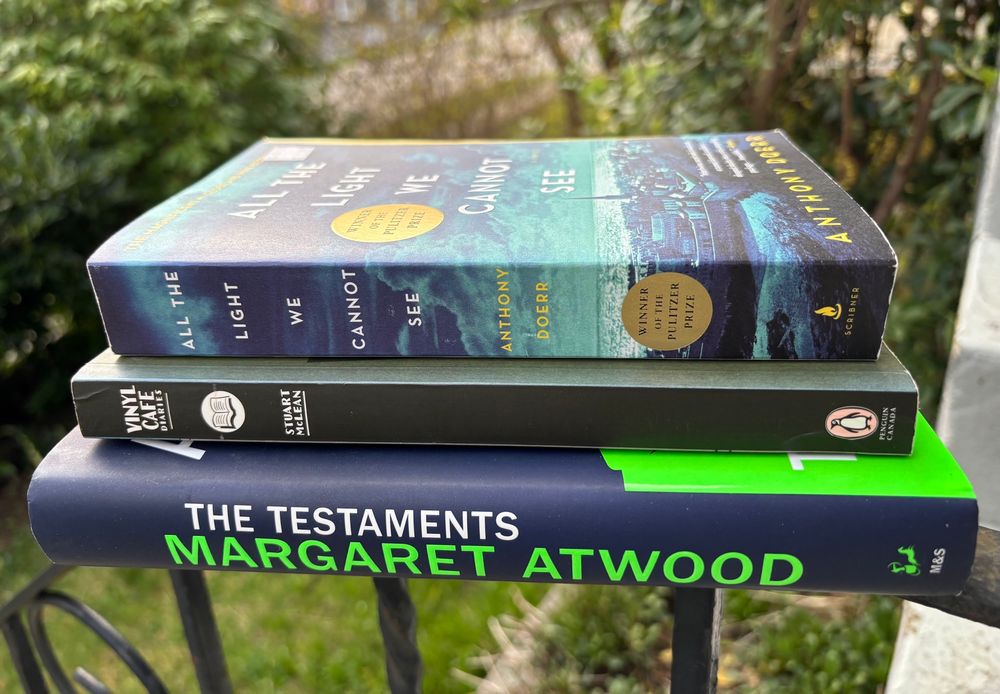 Stack of 3 books: Margaret Atwood "The Testaments", Stuart McLean "Vinyl Cafe Diaries", Anthony Doerr "All the Light We Cannot See"