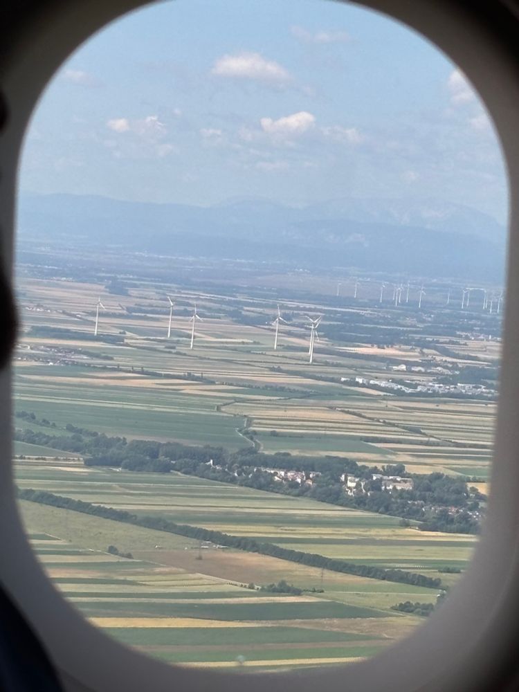 View from plane window landing at Vienna International Airport (VIE)