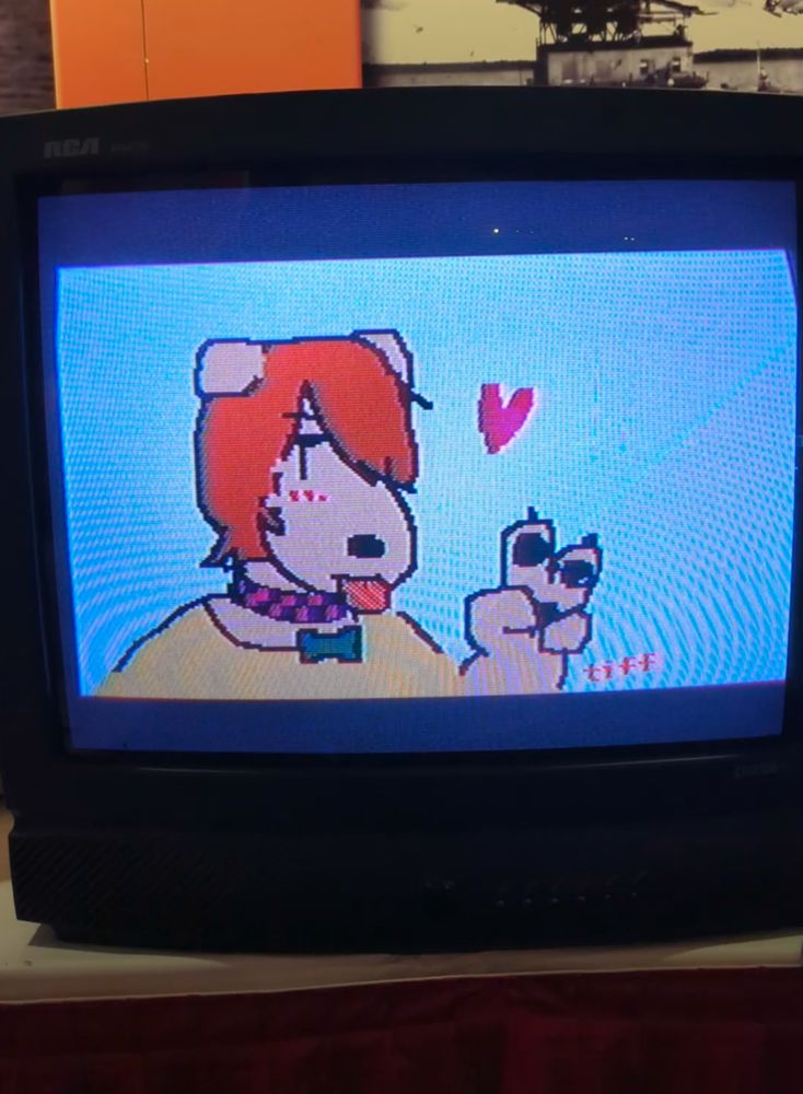 drawing in mario paint of a dog girl making the v sign and sticking out her tongue
