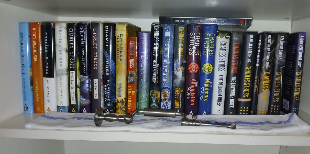 A shelf of early twenty-first century science fiction. And a trepanation drill.