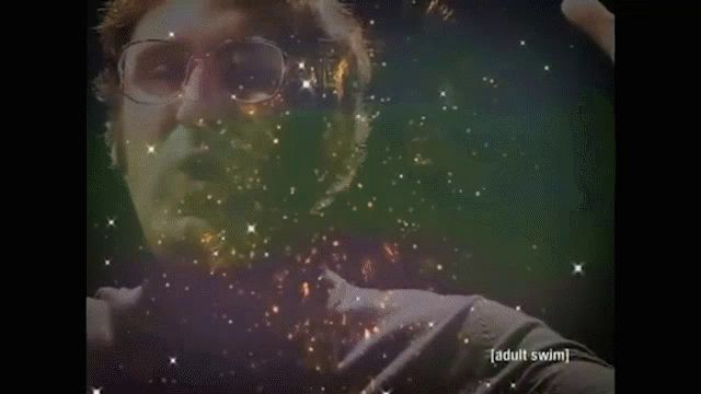 a man in a black turtleneck is holding a light in front of his face and the words adult swim are on the bottom right