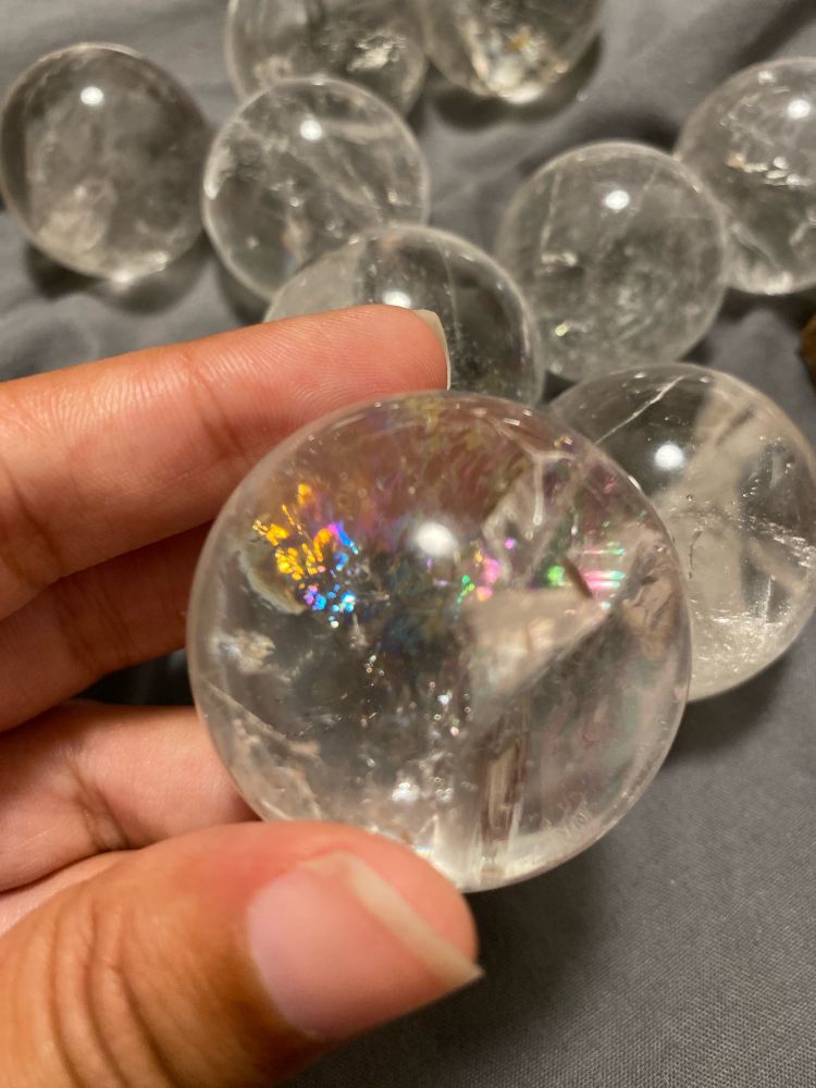 A polished quartz sphere with a rainbow 