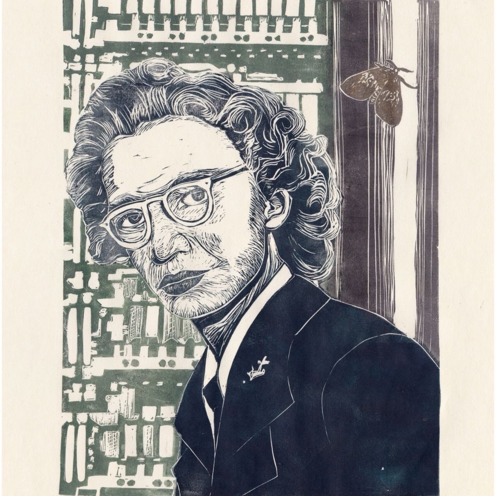 My linocut print of a young Grace Hopper in uniform in dark navy blue with Mark I computer behind here in dark green and grey and the famous moth in dark gold.