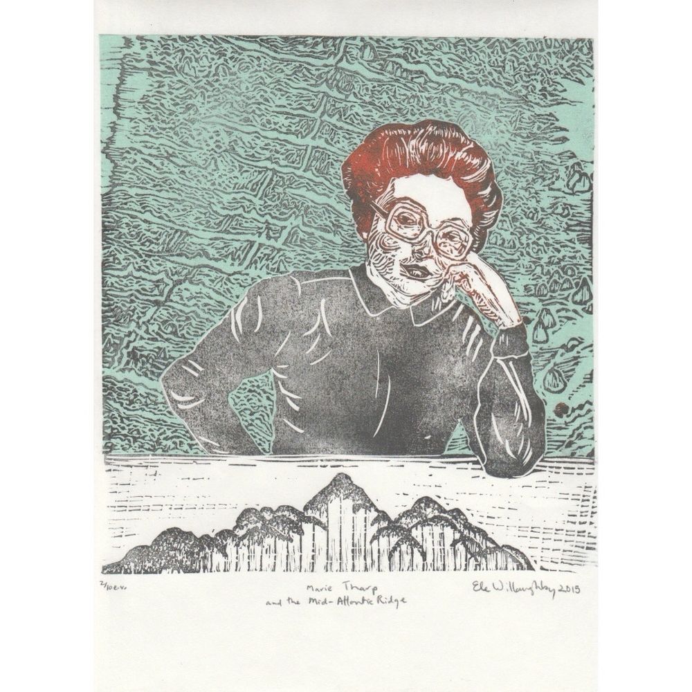 
My linocut portrait of Marie Tharp (woman in grey shirt with oversized glasses and red hair in up-do) in front of her physiographic of the Atlantic (in grey on teal) with mid-ocean ridge, resting her cheek on her left hand with elbow on table covered with depth sounder data.