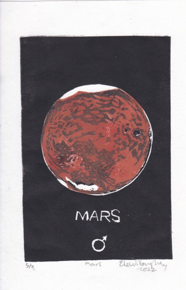 This is a mini print of Mars! This hand-carved, hand-printed linocut is just 5” x 8” (12.7 cm x 20.3 cm) and shows Mars, in orange and brown against a black background, with the word and symbol for Mars. Its tiny, lumpy moons Phobos and Deimos are in black.