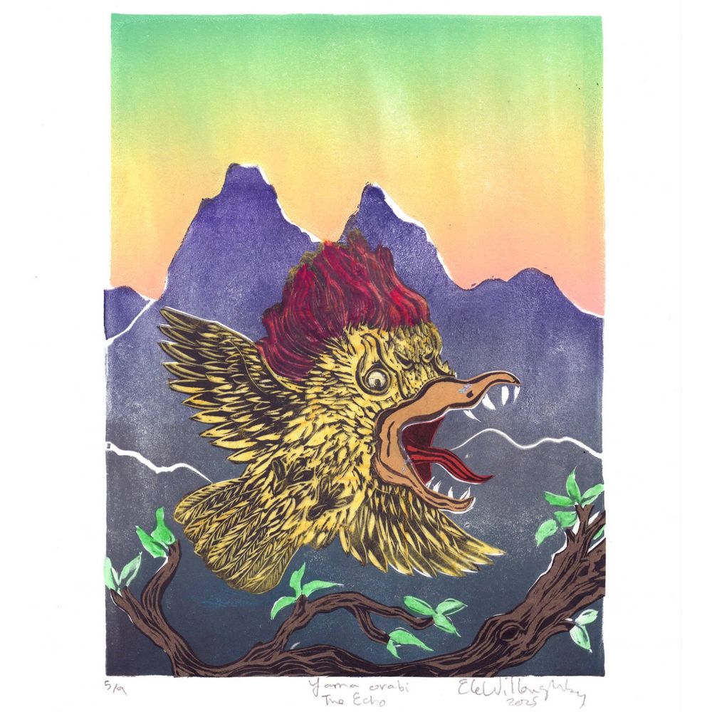 my 8”x10” linocut shows a Yama orabi, a mythical bird like creature with an exceptionally large head and sharp pointy teeth hopping off a brown branch with green leaves in front of a grey and blue-grey mountain at sunset in a gradient of orange, yellow and green sky. The Yama orabi is yellow with an umber beak, red mouth and red plumage on its head.